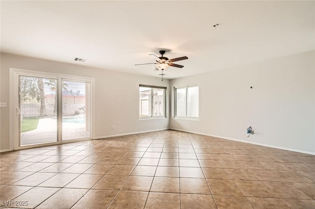 7829 Lovely Pine Pl, Las Vegas, NV 89143 - empty room featuring visible vents, baseboards, a ceiling fan, and light tile patterned flooring
