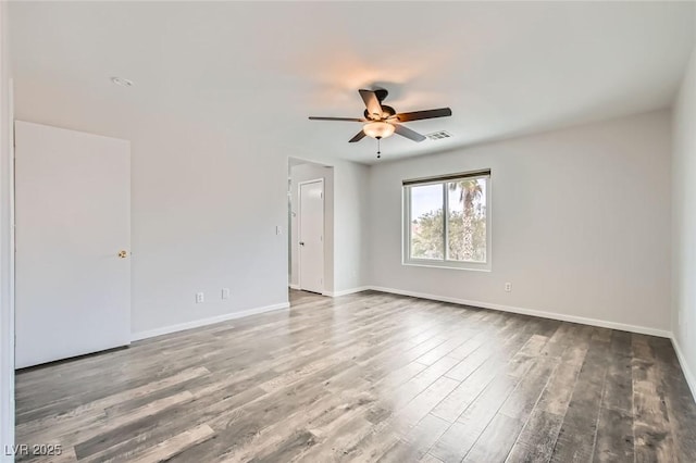 7829 Lovely Pine Pl, Las Vegas, NV 89143 - empty room with visible vents, ceiling fan, wood finished floors, and baseboards