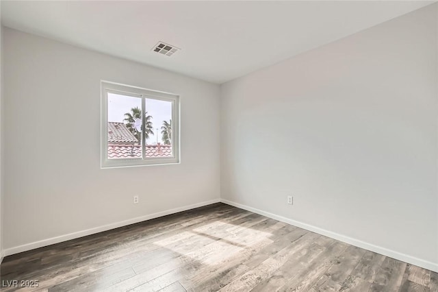 7829 Lovely Pine Pl, Las Vegas, NV 89143 - empty room featuring visible vents, baseboards, and wood finished floors