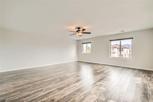 7829 Lovely Pine Pl, Las Vegas, NV 89143 - unfurnished room with visible vents, baseboards, a ceiling fan, and wood finished floors