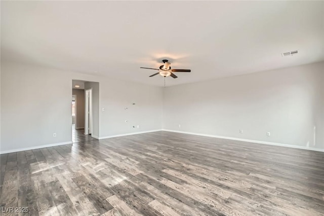 7829 Lovely Pine Pl, Las Vegas, NV 89143 - spare room with visible vents, baseboards, a ceiling fan, and wood finished floors