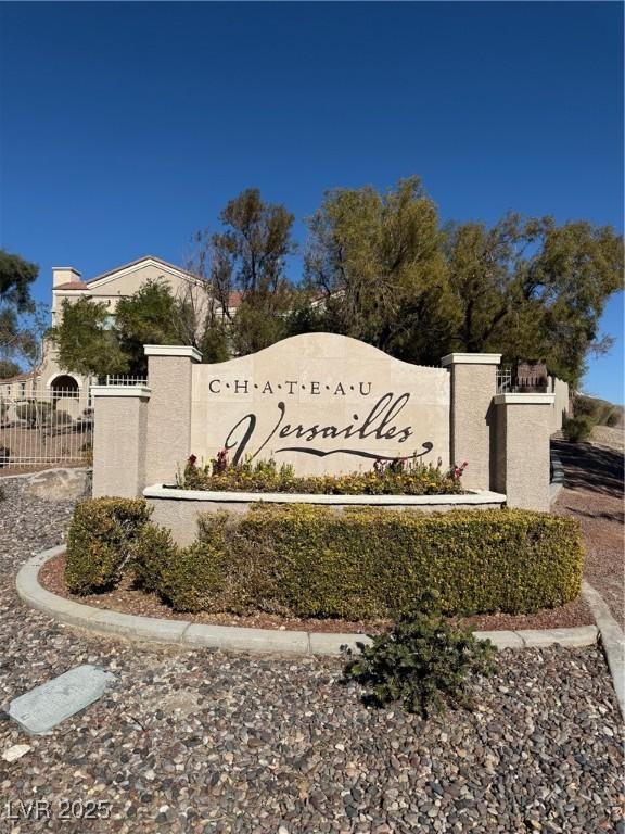 community sign featuring fence