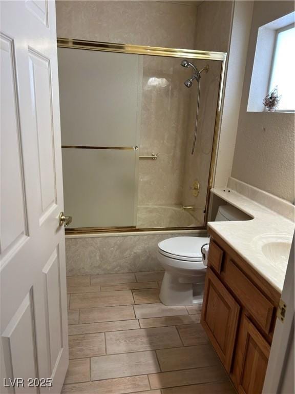 9048 Litchfield Ave, Las Vegas, NV 89134 - full bath featuring vanity, combined bath / shower with glass door, and toilet