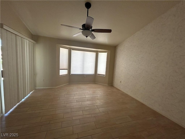 9048 Litchfield Ave, Las Vegas, NV 89134 - unfurnished room featuring ceiling fan, a textured wall, and wood finished floors