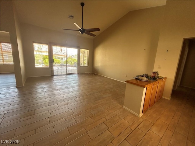 9048 Litchfield Ave, Las Vegas, NV 89134 - empty room featuring a ceiling fan, visible vents, baseboards, high vaulted ceiling, and light wood finished floors