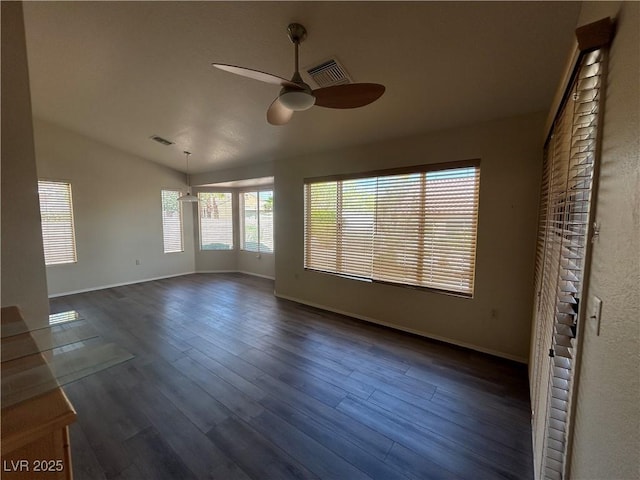 9048 Litchfield Ave, Las Vegas, NV 89134 - empty room featuring ceiling fan, dark wood finished floors, baseboards, lofted ceiling, and visible vents