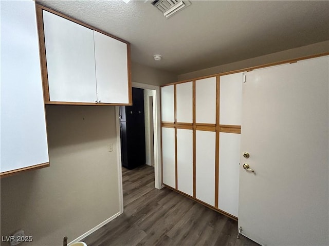 9048 Litchfield Ave, Las Vegas, NV 89134 - hallway featuring wood finished floors and visible vents