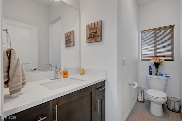 7953 Mountain Lilac St, Las Vegas, NV 89113 - bathroom featuring vanity, baseboards, and toilet
