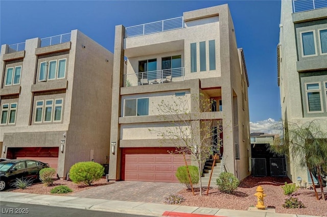 7953 Mountain Lilac St, Las Vegas, NV 89113 - view of front of property with an attached garage, decorative driveway, and stucco siding