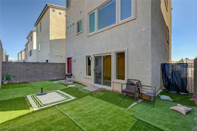 7953 Mountain Lilac St, Las Vegas, NV 89113 - back of house featuring a fenced backyard, a lawn, and stucco siding