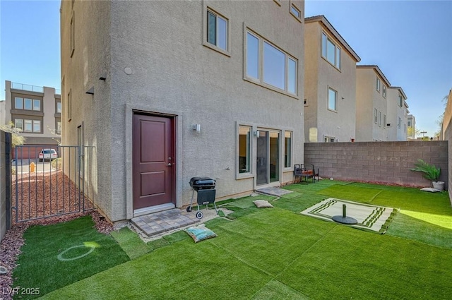7953 Mountain Lilac St, Las Vegas, NV 89113 - rear view of house with a yard, fence, and stucco siding