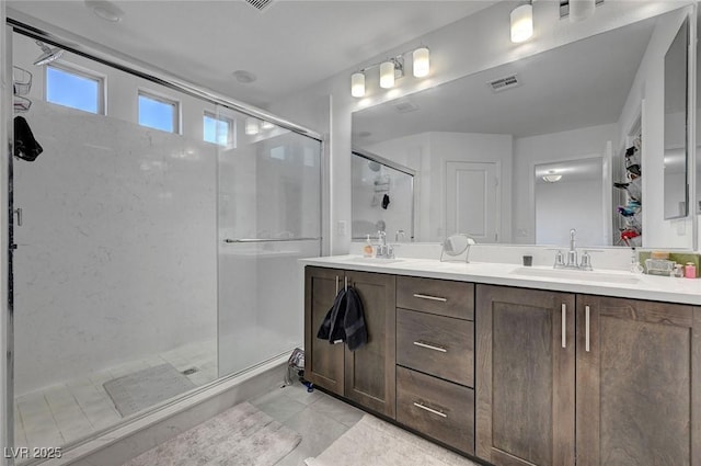 7953 Mountain Lilac St, Las Vegas, NV 89113 - full bathroom with a sink, visible vents, a shower stall, and double vanity