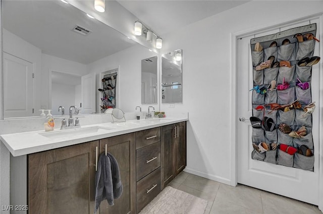 7953 Mountain Lilac St, Las Vegas, NV 89113 - full bathroom featuring tile patterned floors, double vanity, visible vents, and a sink