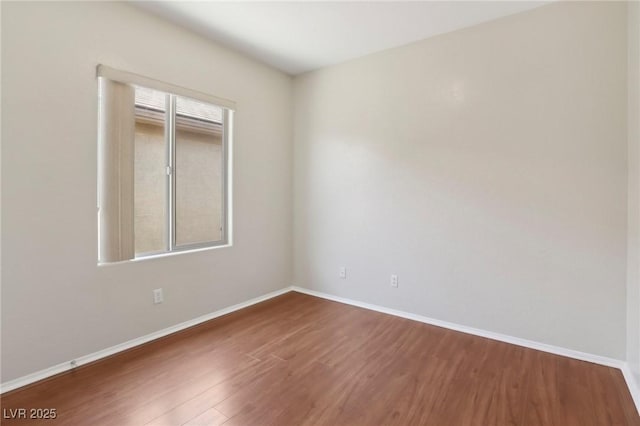6059 Wheat Penny Ave, Las Vegas, NV 89122 - empty room featuring baseboards and wood finished floors