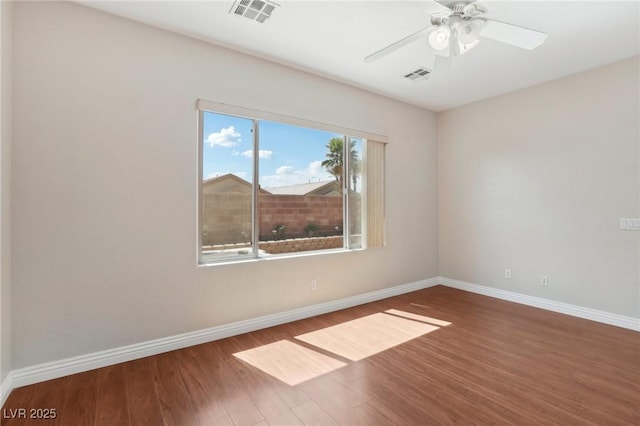 6059 Wheat Penny Ave, Las Vegas, NV 89122 - unfurnished room with ceiling fan, visible vents, baseboards, and wood finished floors