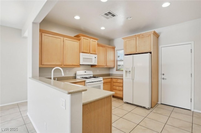 6059 Wheat Penny Ave, Las Vegas, NV 89122 - kitchen with light brown cabinets, white appliances, a peninsula, light countertops, and visible vents