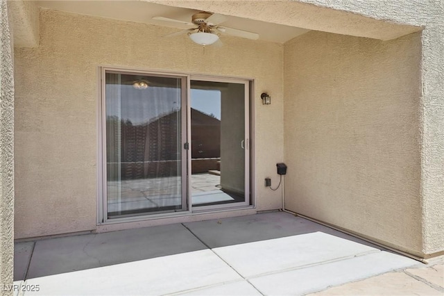 6059 Wheat Penny Ave, Las Vegas, NV 89122 - entrance to property featuring a ceiling fan, a patio, and stucco siding