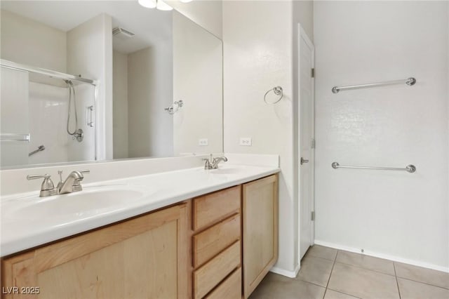 6059 Wheat Penny Ave, Las Vegas, NV 89122 - full bath featuring a sink, visible vents, double vanity, and tile patterned flooring