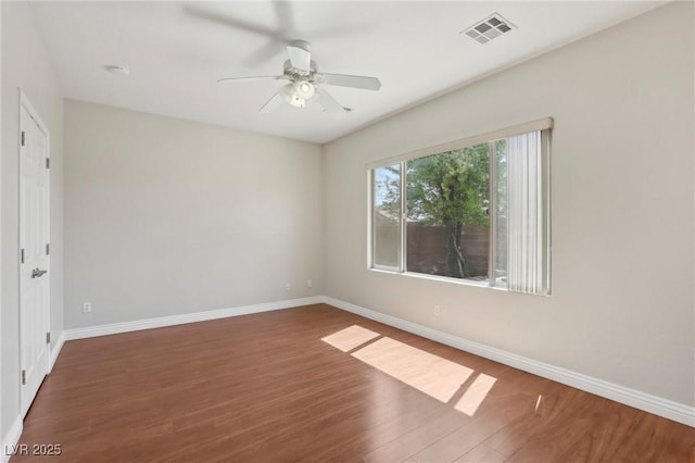 6059 Wheat Penny Ave, Las Vegas, NV 89122 - unfurnished room with ceiling fan, visible vents, baseboards, and wood finished floors