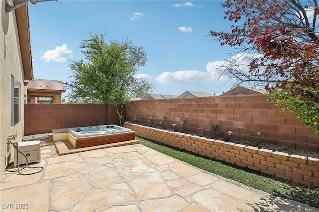 6059 Wheat Penny Ave, Las Vegas, NV 89122 - view of patio with an outdoor hot tub and a fenced backyard