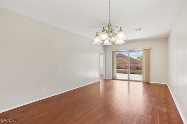 6059 Wheat Penny Ave, Las Vegas, NV 89122 - unfurnished room with visible vents, baseboards, a notable chandelier, and wood finished floors