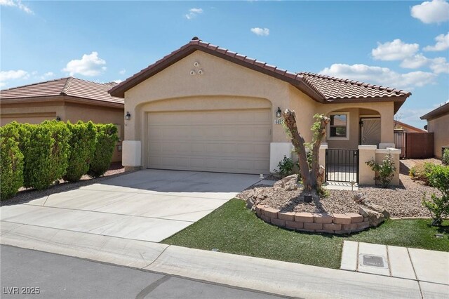 6059 Wheat Penny Ave, Las Vegas, NV 89122 - mediterranean / spanish-style home featuring a tiled roof, stucco siding, fence, an attached garage, and concrete driveway