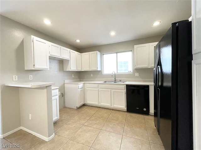 kitchen featuring light tile patterned floors, white cabinetry, black appliances, recessed lighting, and a sink