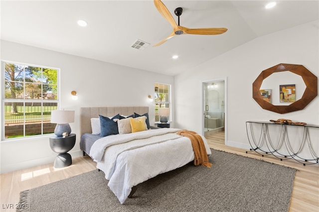 bedroom featuring light wood-style floors, vaulted ceiling, visible vents, and recessed lighting