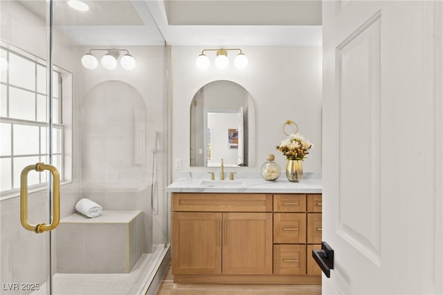 full bathroom featuring a shower stall and vanity