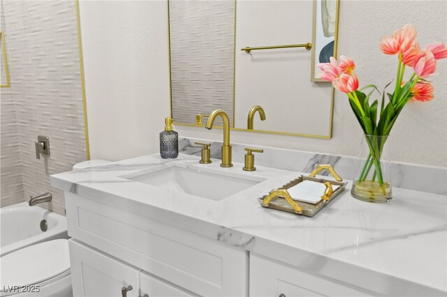 full bathroom featuring vanity and toilet