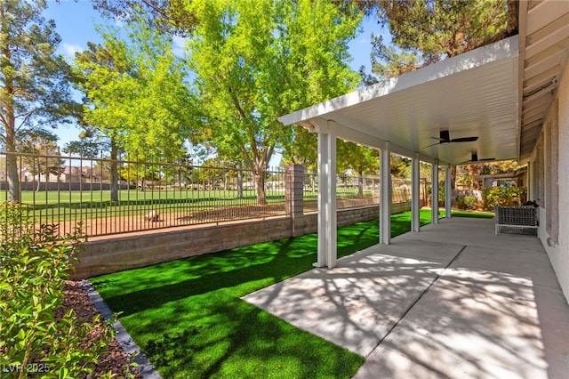 view of patio with ceiling fan and a fenced backyard
