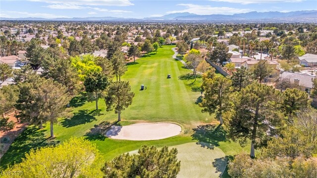 birds eye view of property featuring a mountain view, golf course view, and a residential view
