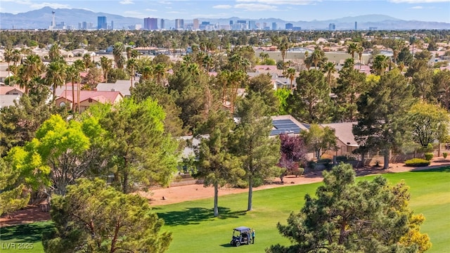 drone / aerial view featuring a view of city and a mountain view
