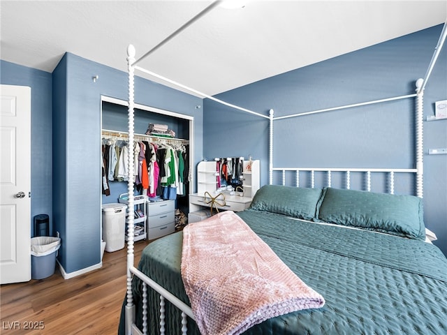 bedroom featuring a closet and wood finished floors