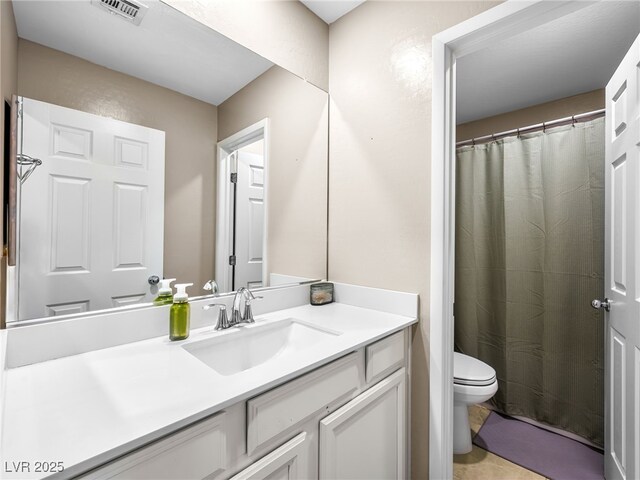 bathroom featuring visible vents, a shower with shower curtain, toilet, vanity, and tile patterned floors