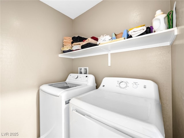 laundry room featuring washer and clothes dryer and laundry area