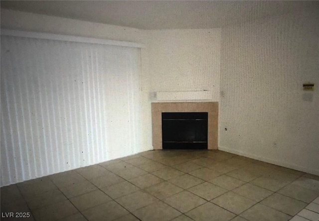 3041 Casey Dr Unit 101, Las Vegas, NV 89120 - unfurnished living room with tile patterned flooring and a tiled fireplace