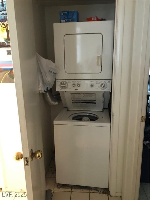 3041 Casey Dr Unit 101, Las Vegas, NV 89120 - washroom featuring stacked washer / drying machine and light tile patterned floors