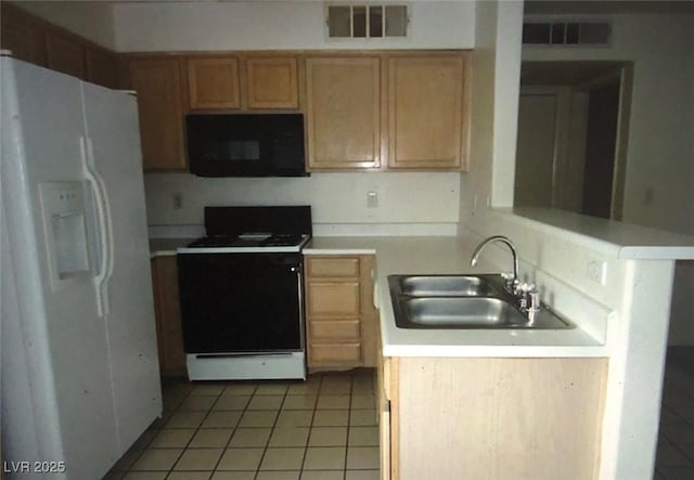 3041 Casey Dr Unit 101, Las Vegas, NV 89120 - kitchen with white refrigerator with ice dispenser, black microwave, range with electric cooktop, light tile patterned flooring, and light countertops