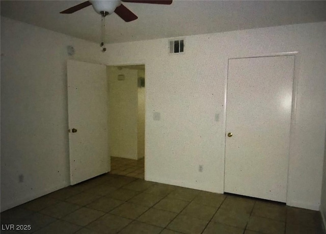 3041 Casey Dr Unit 101, Las Vegas, NV 89120 - empty room with ceiling fan and tile patterned flooring