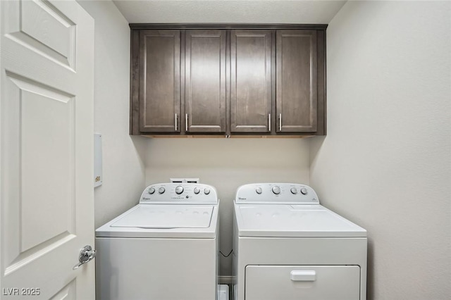 laundry room featuring cabinet space and washer and dryer