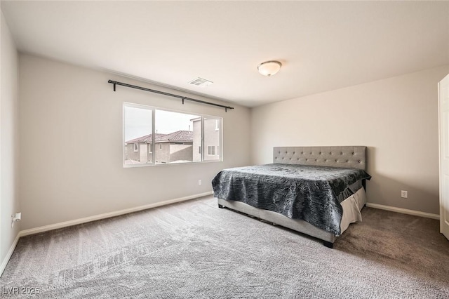 bedroom with baseboards, visible vents, and carpet floors