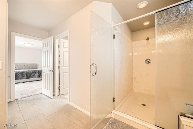full bath featuring a shower stall and tile patterned floors