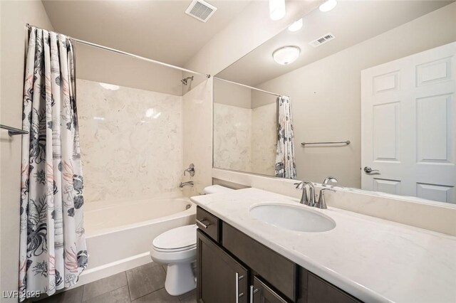 bathroom featuring visible vents, toilet, shower / tub combo, and vanity