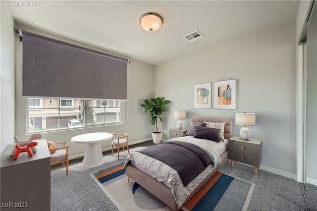 bedroom featuring baseboards, carpet, and visible vents
