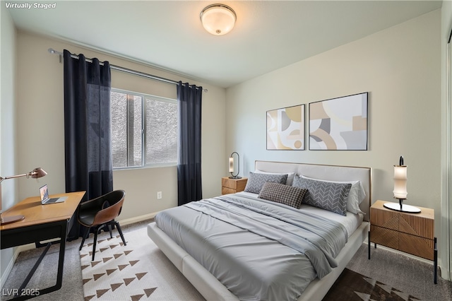 bedroom featuring baseboards and carpet floors