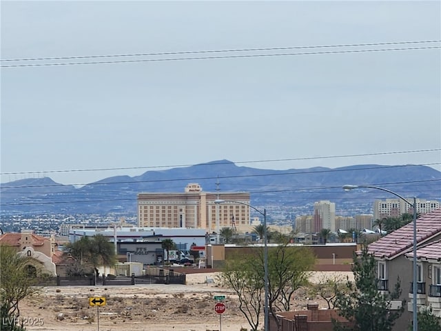 view of water feature featuring a mountain view and a view of city