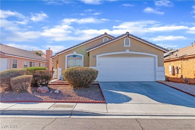 view of front of property featuring stucco siding, driveway, and an attached garage