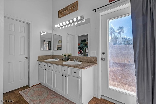 bathroom with double vanity and a sink