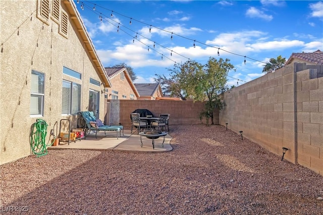 view of yard featuring a fenced backyard and a patio
